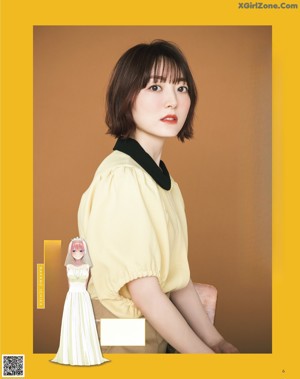 A magazine page with a picture of a woman with short hair.