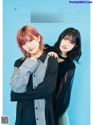 A couple of women standing next to each other on a magazine cover.