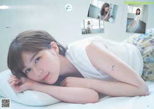 A woman in a white shirt is featured in a magazine.
