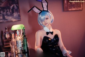 A woman in a bunny costume is posing for a picture.