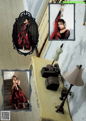A woman in a black and red dress standing in a hallway.