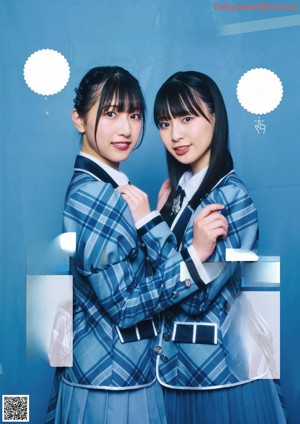 A group of young women in school uniforms posing for a magazine.
