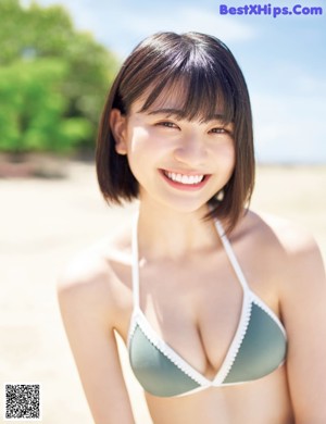 A woman in a bikini and a girl in a sailor outfit.