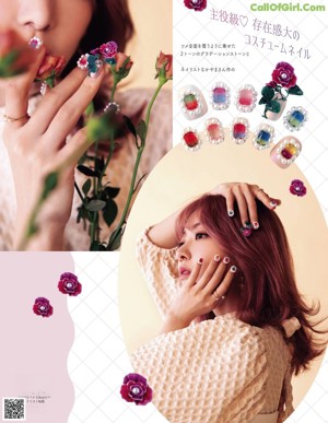 A magazine cover with a woman with pink hair and nails.
